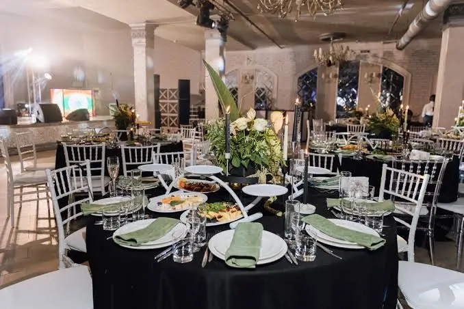 Large Pakistani wedding buffet spread with chafing dishes set up for a walima celebration in London