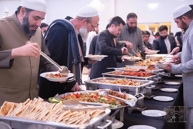 Halal Pakistani dishes including chargha and karahi served at a Wembley community event