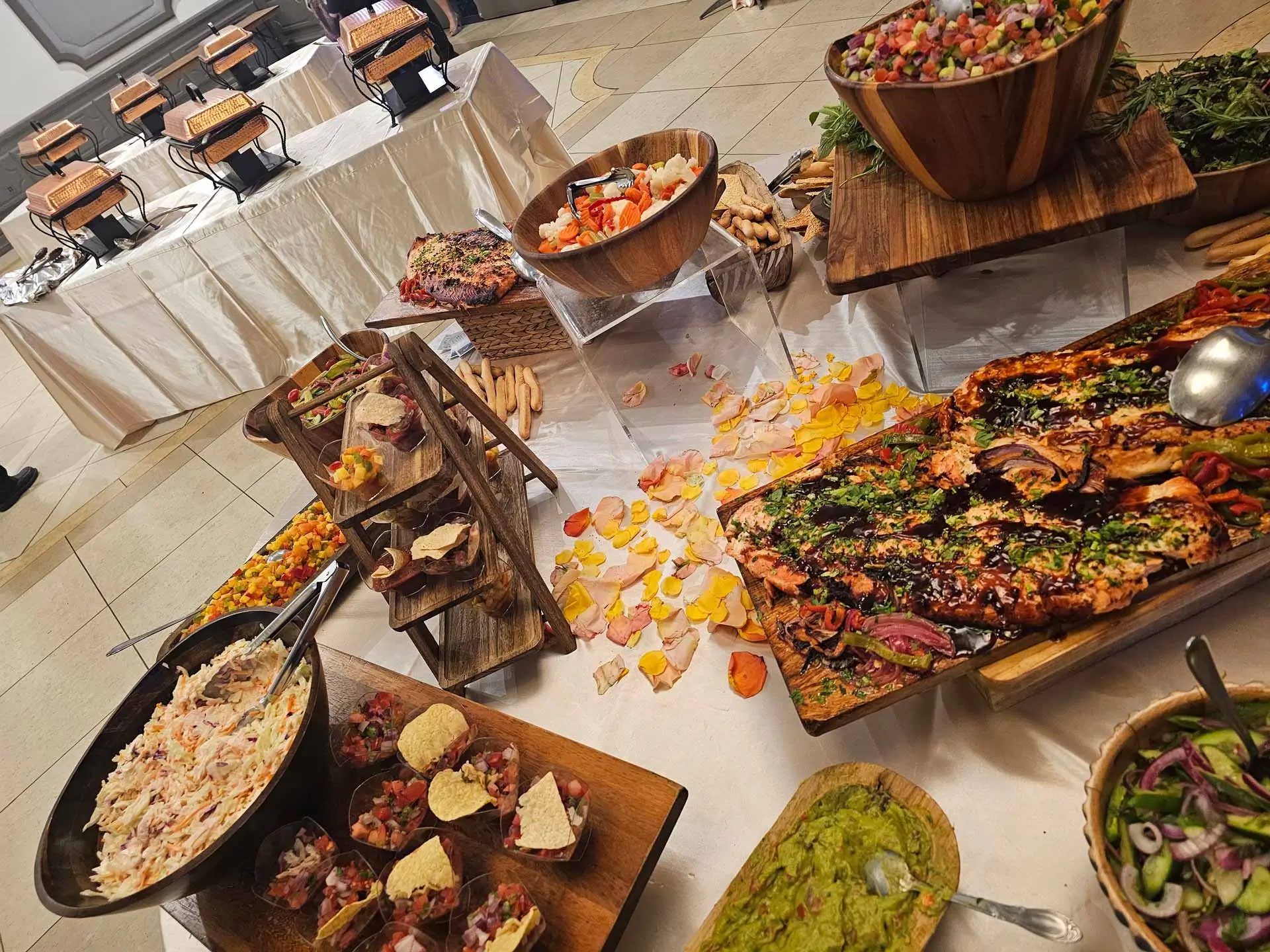 Guests serving themselves at a Pakistani buffet catering event, London.