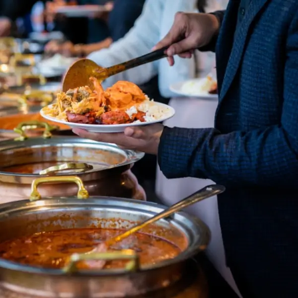 Corporate catering service in London setting up a halal buffet at an office event